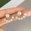 gold fan pearl drop earrings | elegant statement studs for women | modern bridal earrings | minimalist korean style jewelry by alka jewels